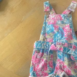 Jumpsuit for toddler. It’s pink and blue brand new and hasn’t been worn.